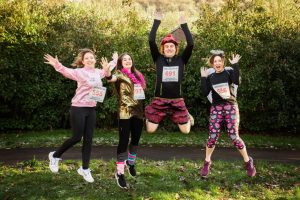 Fun runners jumping in joy