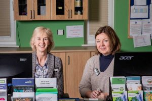 receptionists Caroline and Helen