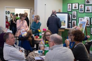 People enjoying refreshments in the atrium
