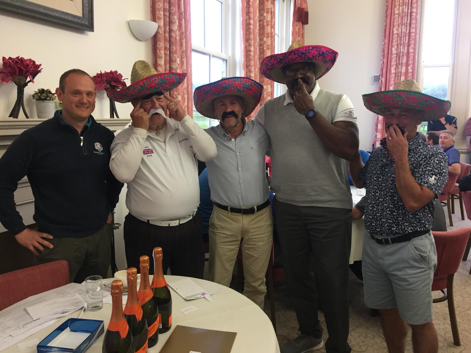 winning team in bandit sombreros at the golf day