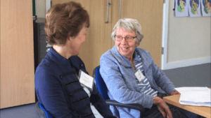 two women in discussion