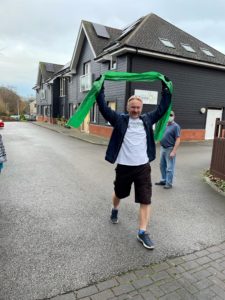 ian walking through a finish line