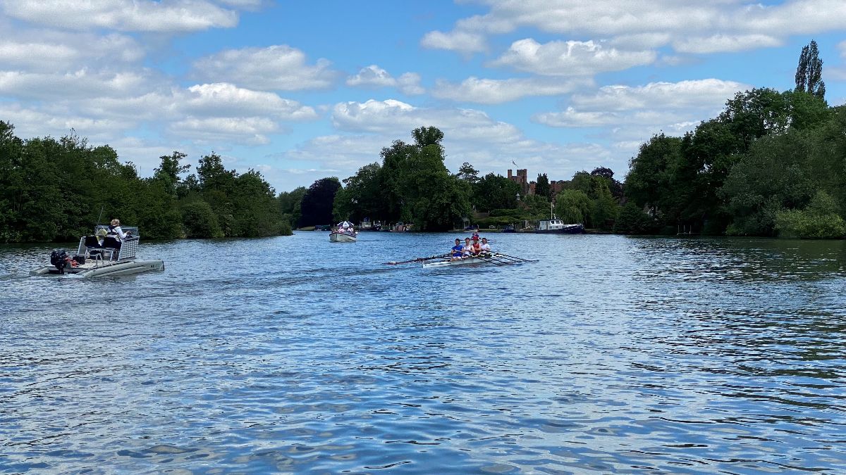 Rowing boats gliding along a river